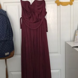 A strapless maroon long dress